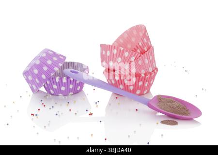 Baking powder and colorful dotted paper vintage baking forms isolated on white background. I love baking concept Stock Photo