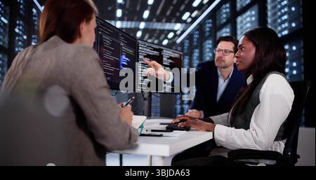 Innovative African Programmer Collaborating With Diverse Development Team In Cyber Office Stock Photo