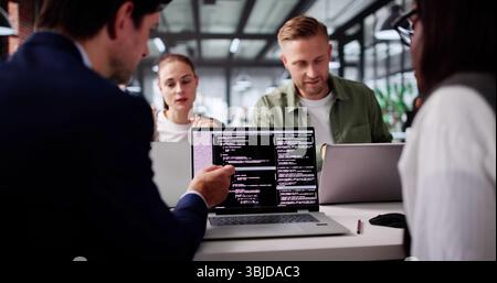 Innovative African Programmer Collaborates With Diverse Team On Coding Methodologies Stock Photo