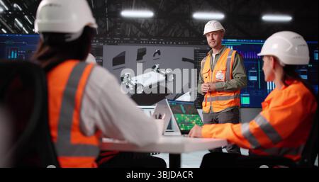 African American Engineer Teaching At Car Factory Using 3D CAD. Stock Photo