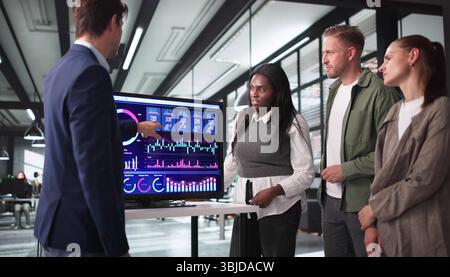 Successful Businesswoman Directing Team Meeting In High-Tech Conference Room. Stock Photo