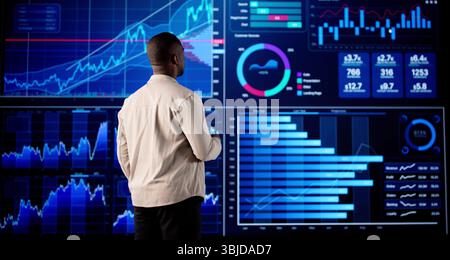 Could Be A Financial Advisor Analyzing Stock Trades On His Computer. Stock Photo