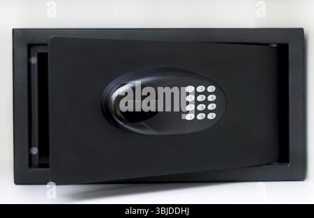 Black small home or hotel safe with keypad Stock Photo