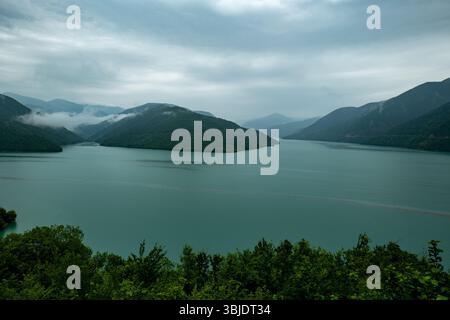 Scenic View of a Serene Mountain Lake Amidst Cloudy Weather, Zhinvali Water Reservoir, Georgia Stock Photo