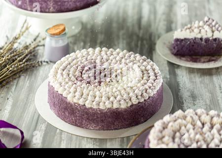 Purple lavender cake with creamy milk topping, delicate and elegant. Stock Photo
