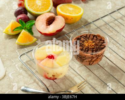Cold layered dessert with chocolate mousse and fruit mousse. Stock Photo