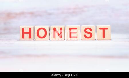 The concept word HONEST is assembled from cubes. Business integrity ...