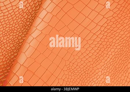 Orange color artificial crocodile leather texture as background. Stock Photo