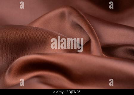 Dark brown color silk texture, Abstract as background. Stock Photo