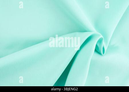 Texture of turquoise fabric as background, top view. Stock Photo