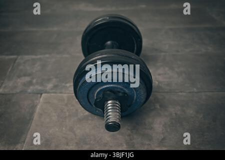 High angle view of dumbbell on floor. Horizontal image. Stock Photo