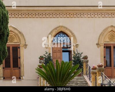 Traditional European Architecture with Arched Doorways and Ornate Facade Details Stock Photo