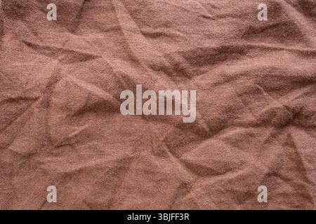 Brown wrinkled  close up fabric, abstract rustic  backdrop Stock Photo