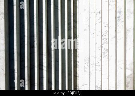 Abstract white marble background with vertical stripes and shadows. Stock Photo