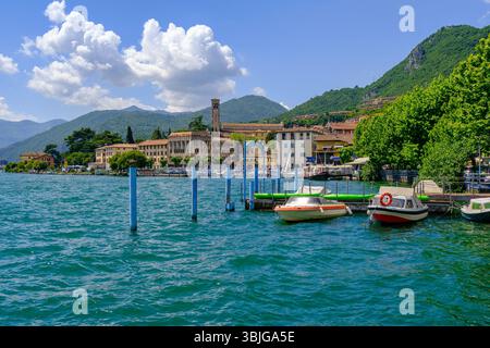 Boats moored in the harbour on shores of Lake Iseo, Lovere Lombardy, Italy Stock Photo