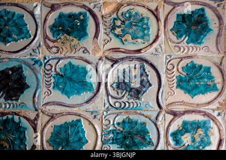 Worn tiles on wall in Partugal Stock Photo