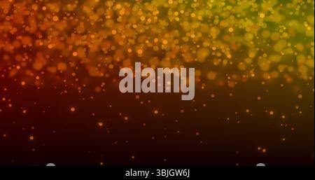 Drifting amber and yellow-green bokeh spots floating on dark gradient background, brightening scene Stock Photo