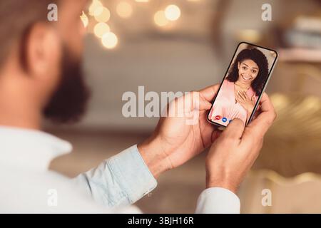 Black couple having online date using smart phones Stock Photo