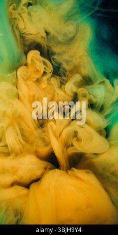Ink splash mist yellow art color dust cloud splash Stock Photo - Alamy