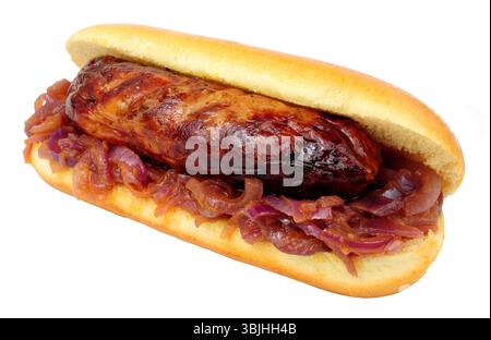 Grilled pork sausage in a brioche bread finger roll with fried onions isolated on a white background Stock Photo