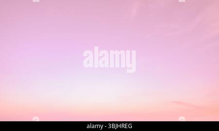 Beautiful pink sky texture background during sunset creating soft pastel gradient perfect for romantic design projects and feminine marketing material Stock Photo