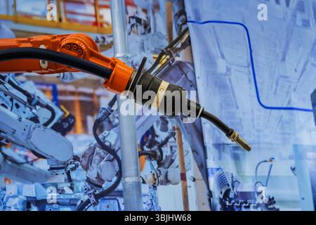 Automated Welding Robot Arm Precision in Manufacturing Process Industrial Equipment Machinery and Robotics Solutions. Stock Photo