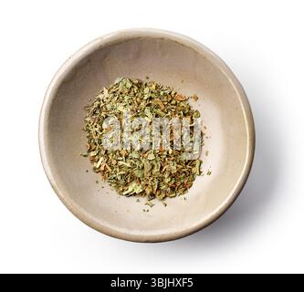 bowl of dried basil isolated on white background, top view Stock Photo