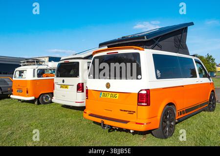 A vintage Volkswagen camper van parked in a suburban street ...