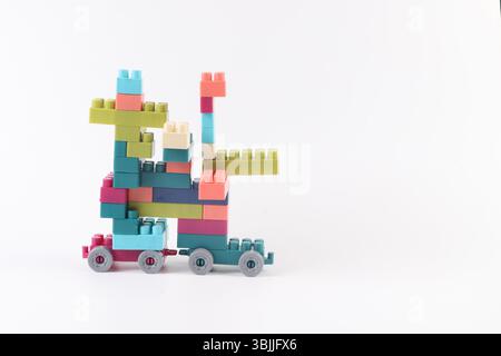Plastic building blocks form vehicle on white background Stock Photo