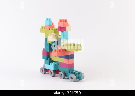 Plastic building blocks form vehicle on white background Stock Photo