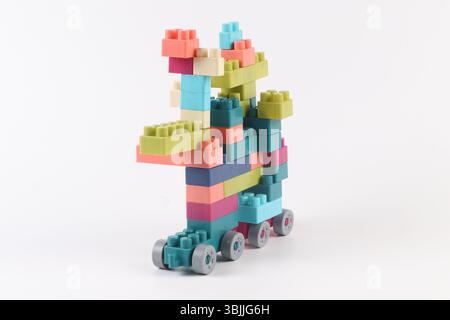 Plastic building blocks form vehicle on white background Stock Photo