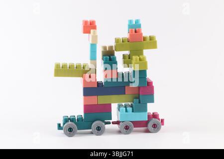 Plastic building blocks form vehicle on white background Stock Photo