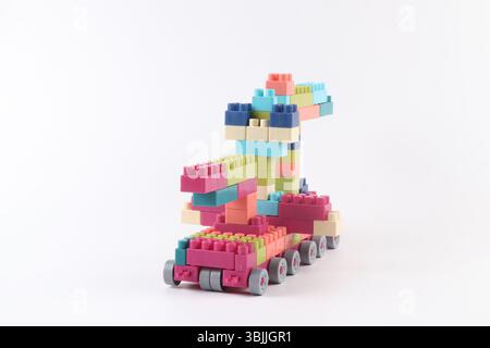 Plastic building blocks form vehicle on white background Stock Photo