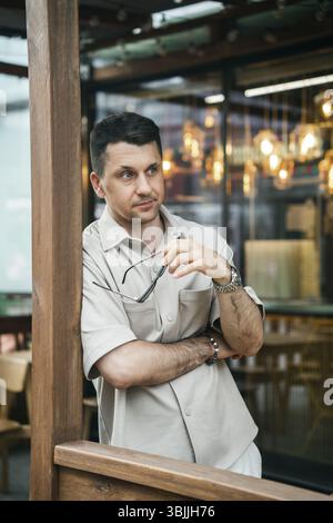 Portrait of a man in a light shirt outdoors Stock Photo
