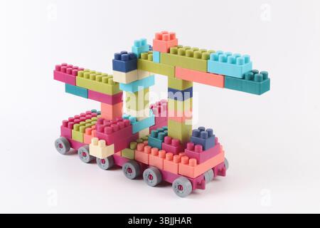 Plastic building blocks form vehicle on white background Stock Photo