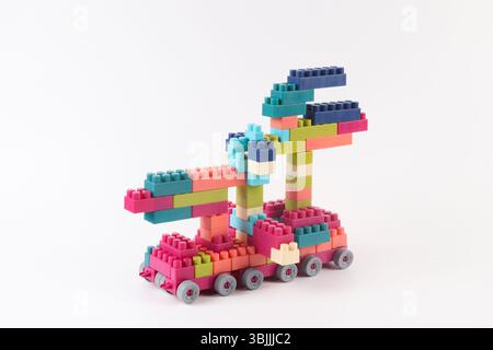 Plastic building blocks form vehicle on white background Stock Photo