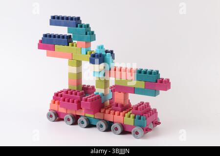 Plastic building blocks form vehicle on white background Stock Photo