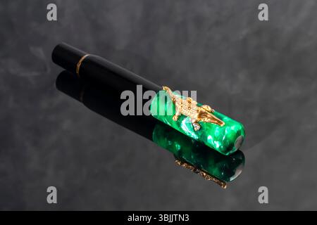 Branded pen in a box. Gift set. Selective focus. Office interior. Copy space Stock Photo
