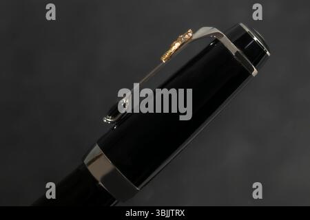 Branded pen in a box. Gift set. Selective focus. Office interior. Copy space Stock Photo