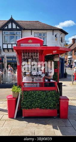 The tiny Brucester's coffee kiosk is located in an classic old red phone box in the centre of Stratford-Upon-Avon, Warwickshire, UK Stock Photo