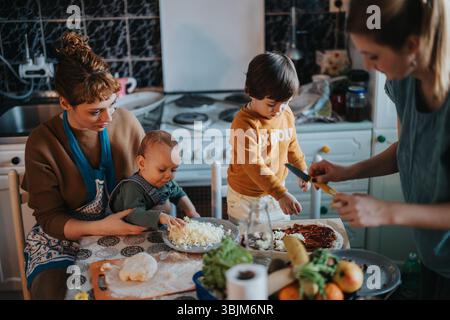 Family Bonding Through Cooking Together in a Cozy Kitchen Stock Photo