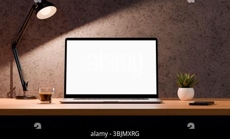 Blank screen of laptop for mockup. Workspace with computer, coffee cup, plant and desk lamp. Horizontal format. Stock Photo