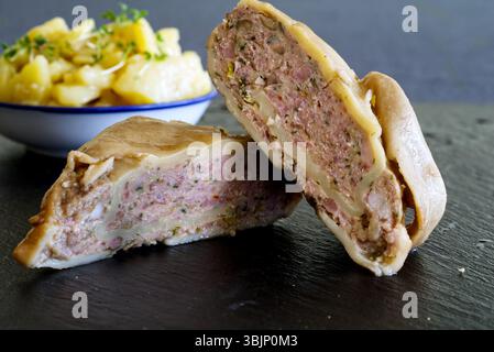 "Maultaschen", a south-german dumpling with potato salad Stock Photo