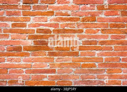 Rustic Tuscan wall with Red bricks showcasing traditional craftsmanship. Perfect for architectural, historical, and texture design projects and backgr Stock Photo