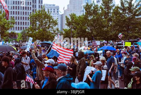 Dire Distress: Large crowd marches through the streets for No Kings Protest in Philadelphia, PA to protest Trump's America on June 14, 2025 Stock Photo
