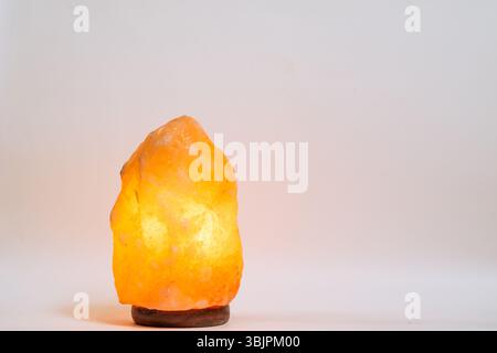 Himalayan salt lamp on white background with copy space Stock Photo