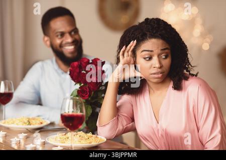 Black Woman On Unsuccessful Date In Restaurant Stock Photo