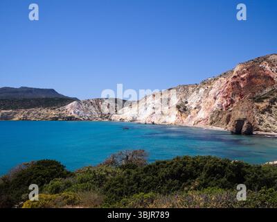 Aerial image of Firiplaka Beach, Milos, with vibrant blue sea and mineral-rich cliffs, Cyclades, Greece Stock Photo