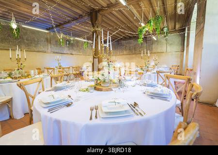 Elegant wedding decor in a rustic room with fairy lights and green accents, event and wedding location Kloster Lorch, Lorch, Germany, Europe Stock Photo