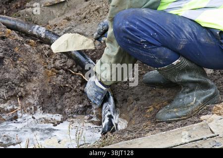Drilling in soil science and construction (study of soil structure at different depths). Obtaining a core (sample). A special composition is used to g Stock Photo